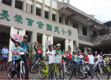 Students ride bicycles