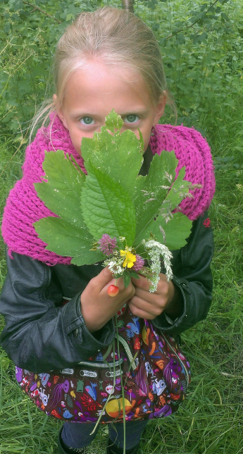 Student holding a leaf