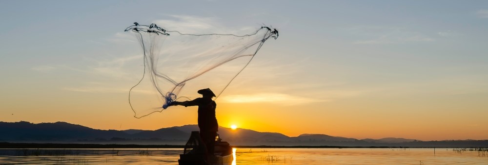 Fisherfolk casting a net