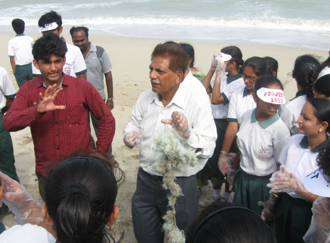 Teachers and students on a beach