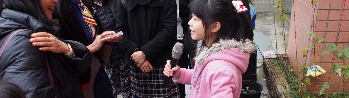 A girl holds a microphone 
