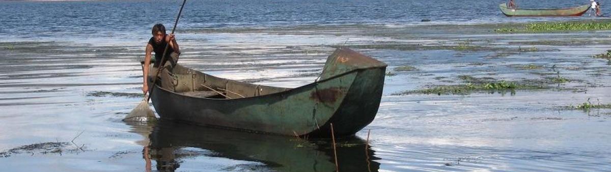 Human in a small fishing boat