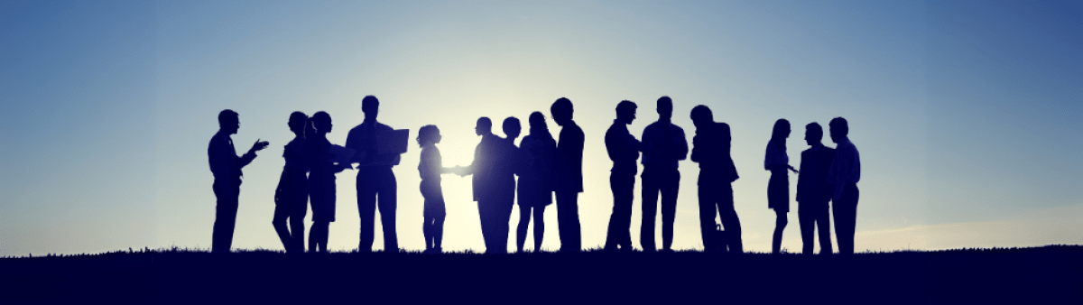 People together against a blue sky