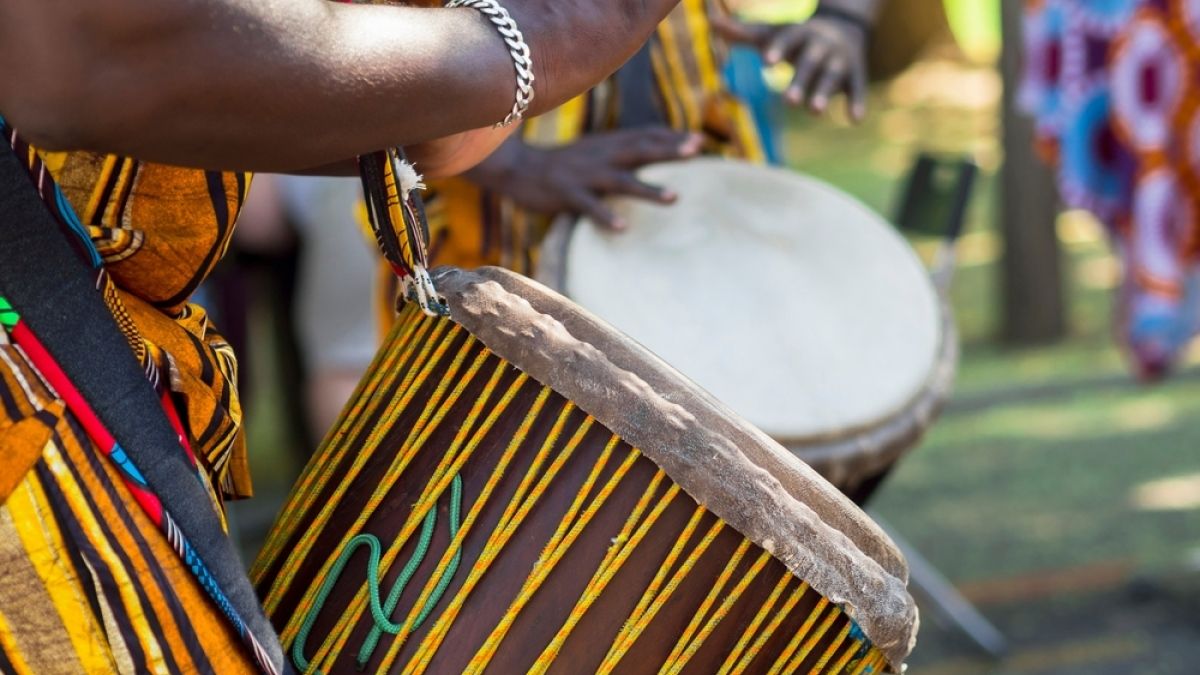 person playing a drum