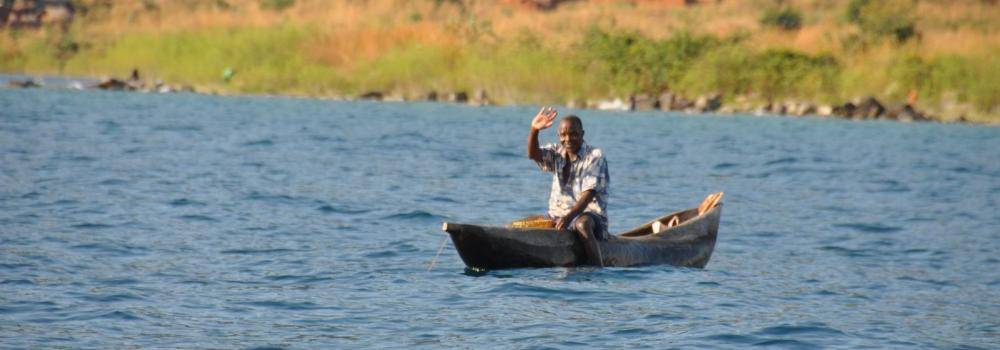 Man boating on lake in Malawi